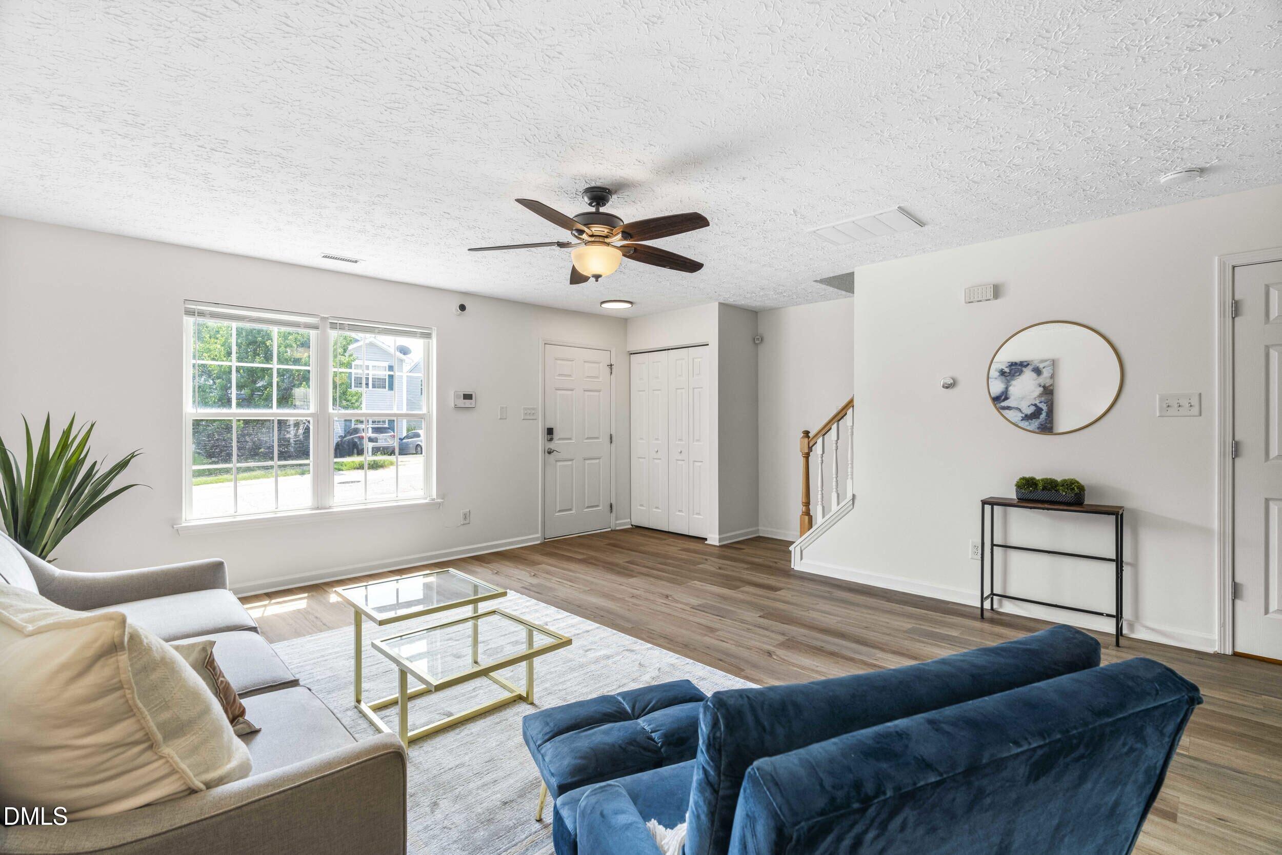 4121 Tensity Drive Raleigh, NC 27604 - Photo 6 of 34 Living room open to the front entry and staircase