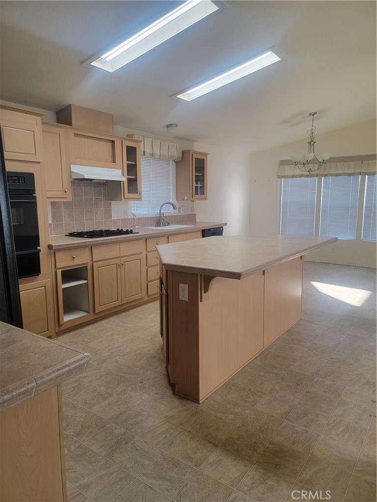 20230 Planada Court Riverside, CA 92508 - Photo 5 of 9 a kitchen with stainless steel appliances granite countertop a stove a sink and a refrigerator