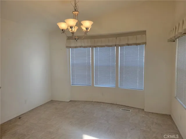 a view of a livingroom with a chandelier fan