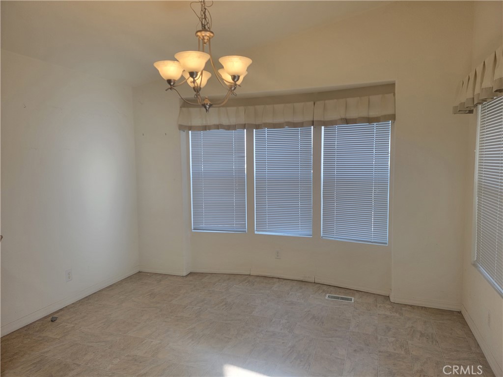 20230 Planada Court Riverside, CA 92508 - Photo 7 of 9 a view of a livingroom with a chandelier fan