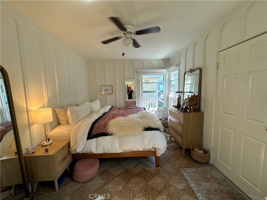 220 Cliff Drive Laguna Beach, CA 92651 - Photo 1 of 1 a bedroom with a bed and wooden floor