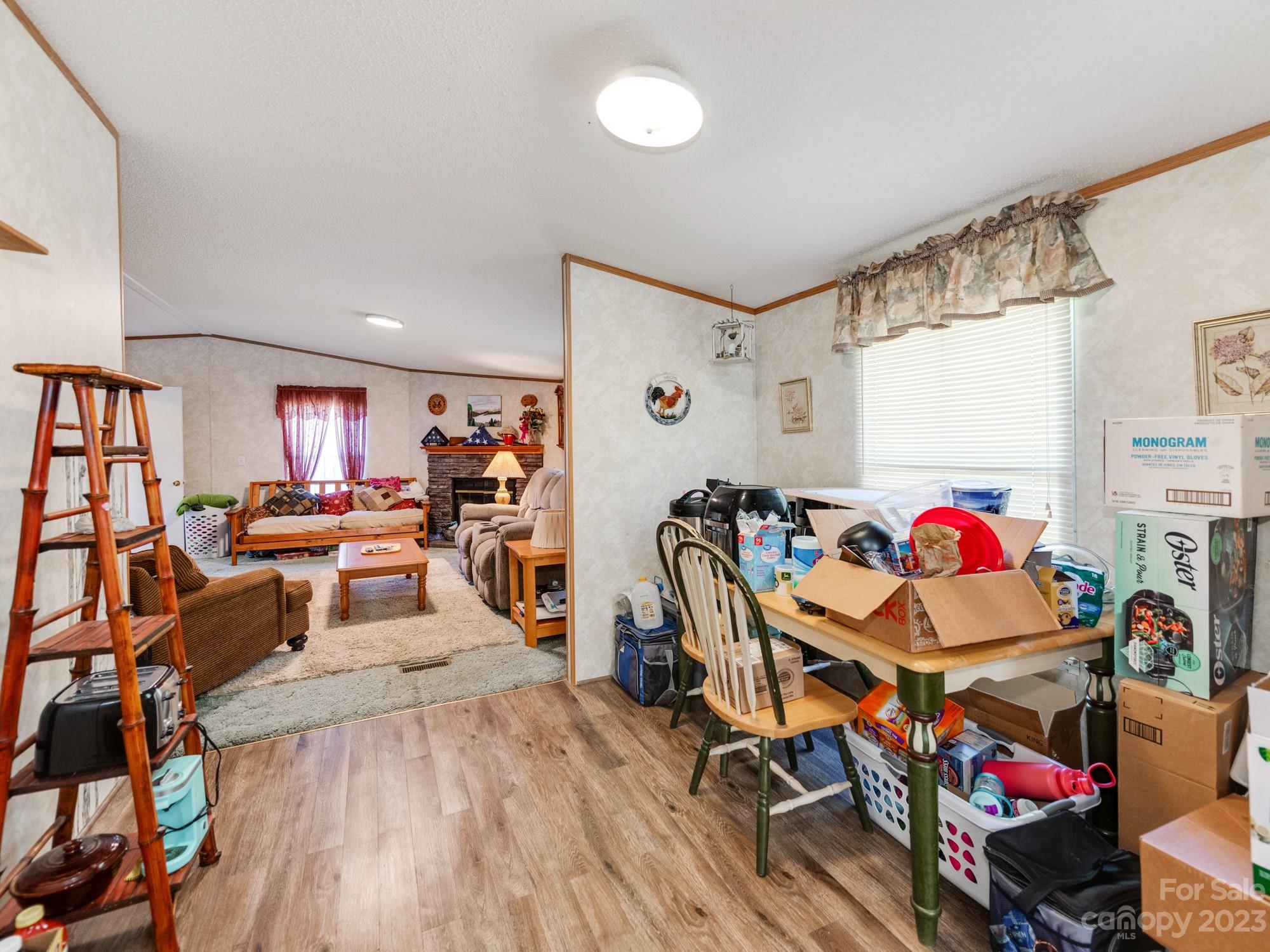 1168 Hopps Road Chester, SC 29706 - Photo 16 of 32 a living room with lots of furniture and a wooden floor