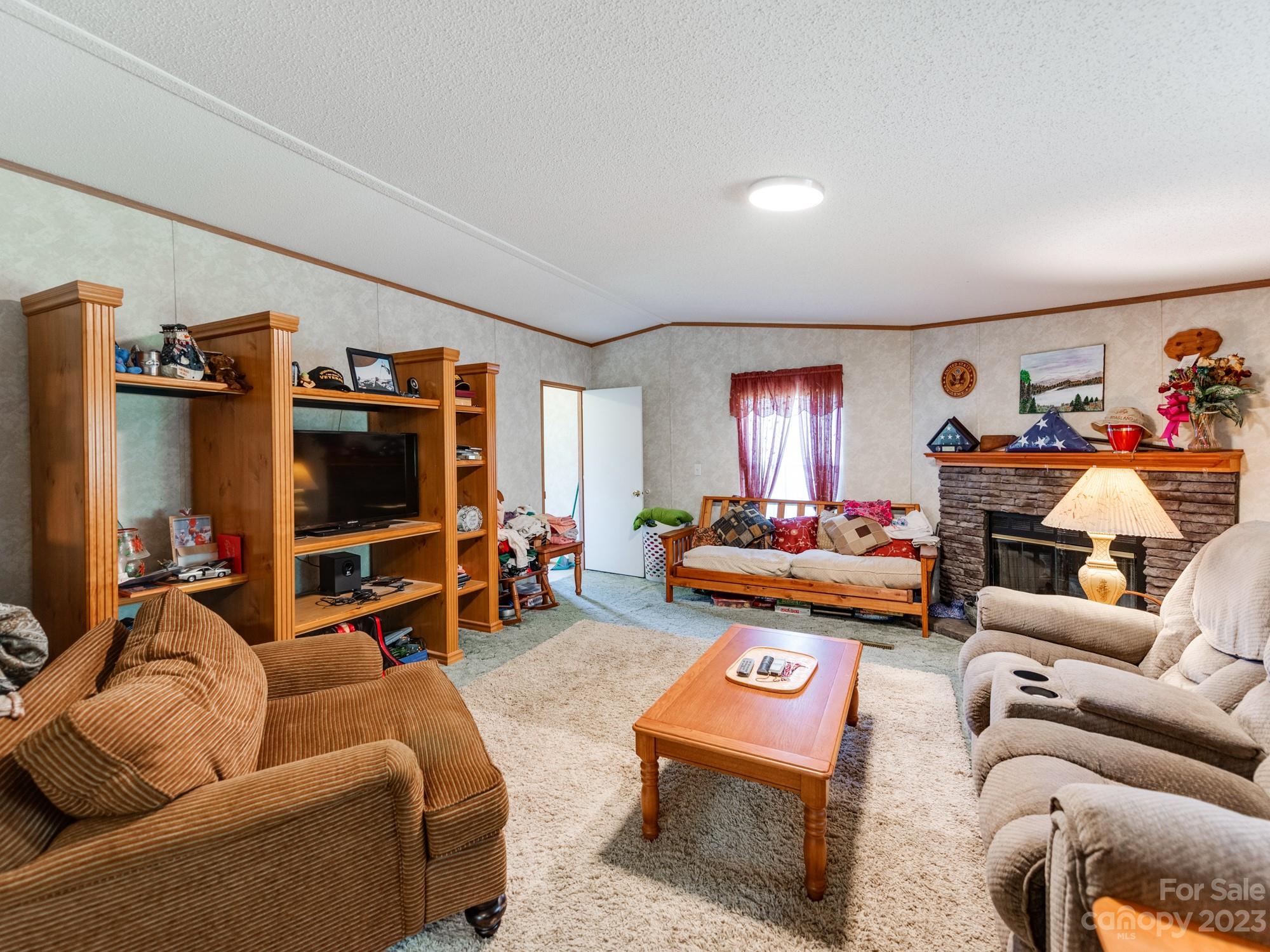 1168 Hopps Road Chester, SC 29706 - Photo 17 of 32 a living room with furniture and a flat screen tv