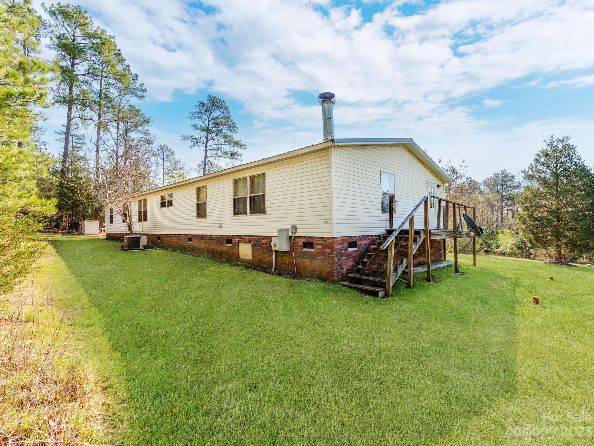 1168 Hopps Road Chester, SC 29706 - Photo 32 of 32 a view of a house with a backyard