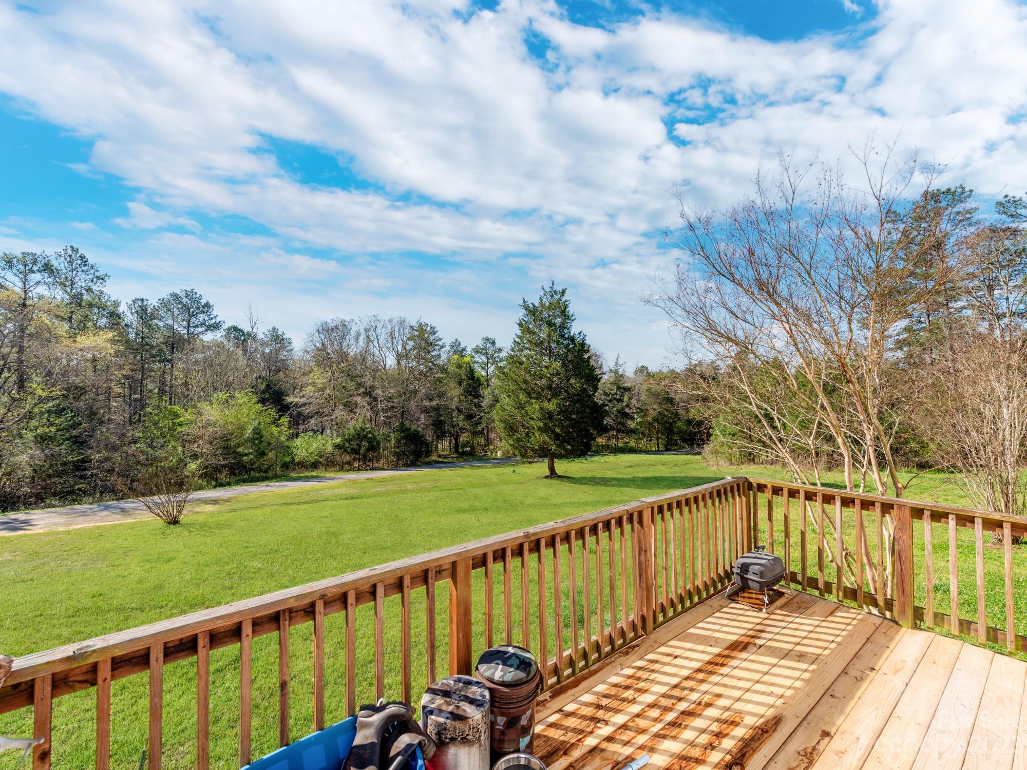 1168 Hopps Road Chester, SC 29706 - Photo 4 of 32 a view of a wooden deck with a yard