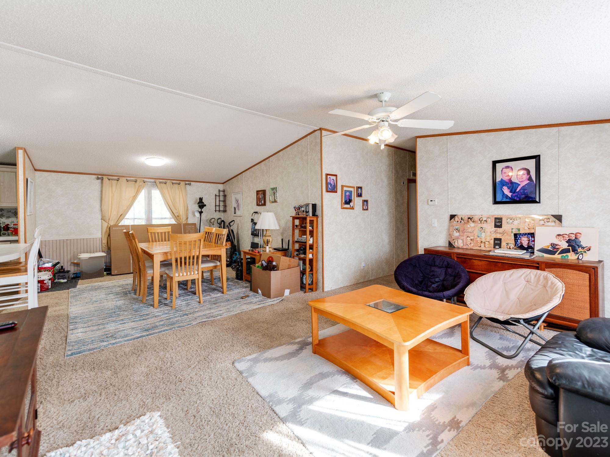 1168 Hopps Road Chester, SC 29706 - Photo 7 of 32 a living room with furniture a table and chairs
