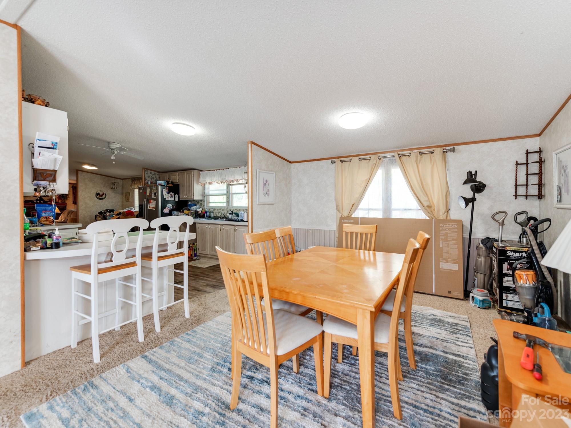 1168 Hopps Road Chester, SC 29706 - Photo 10 of 32 a view of a dining room with furniture and wooden floor