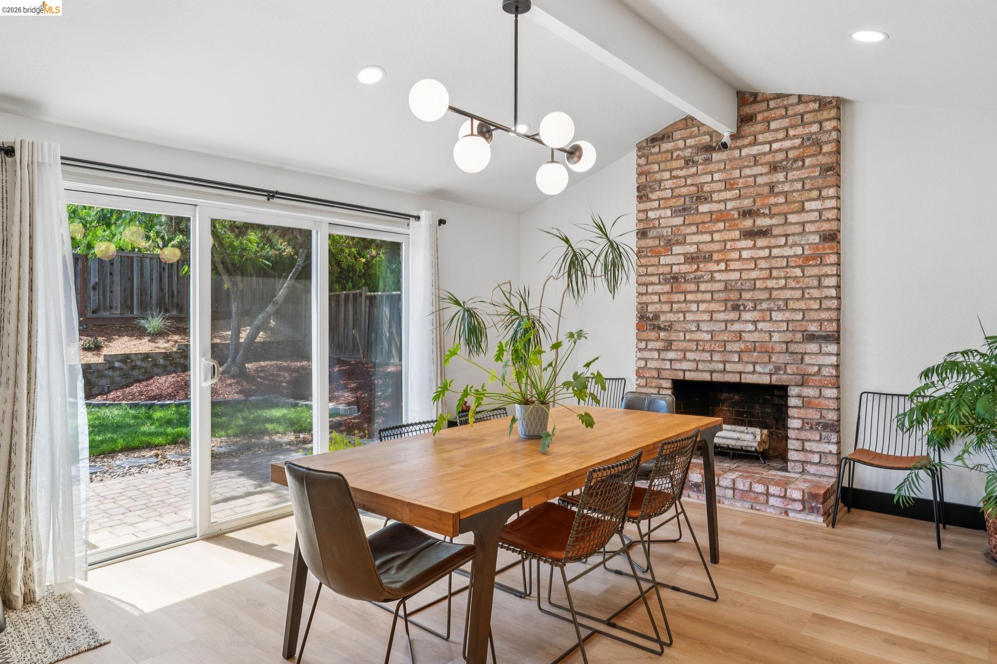 3093 Diablo View Road Pleasant Hill, CA 94523 - Photo 13 of 43 Dining room with a fireplace, light wood-style flooring, a chandelier, and recessed lighting