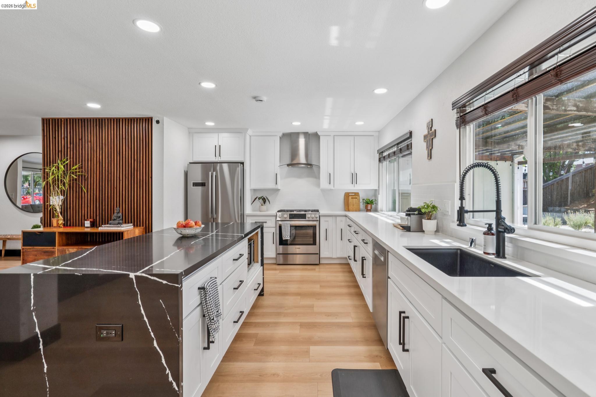 3093 Diablo View Road Pleasant Hill, CA 94523 - Photo 14 of 43 Kitchen featuring white cabinetry, dark stone counters, recessed lighting, light wood finished floors, and appliances with stainless steel finishes