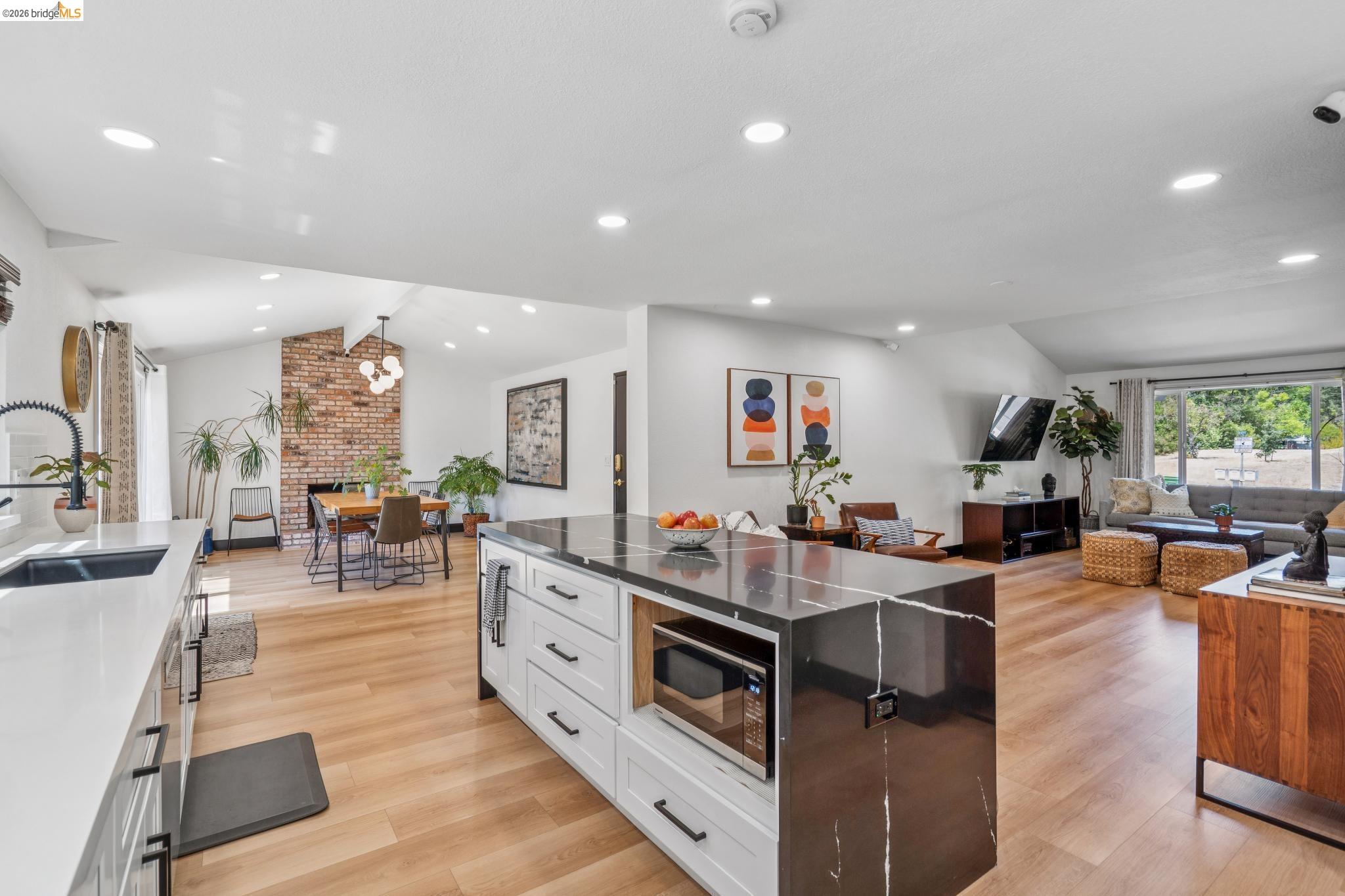 3093 Diablo View Road Pleasant Hill, CA 94523 - Photo 42 of 43 Kitchen with dark stone countertops, pendant lighting, open floor plan, light wood finished floors, and recessed lighting