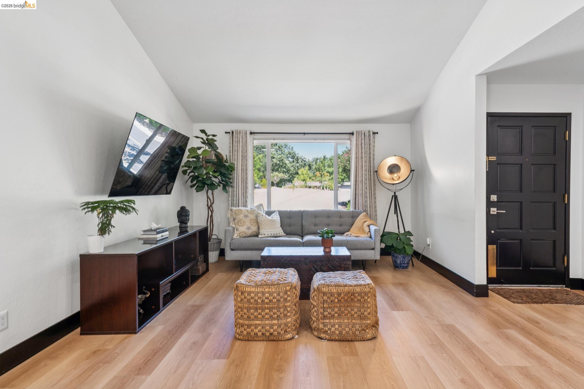 3093 Diablo View Road Pleasant Hill, CA 94523 - Photo 23 of 43 Living area with light wood-type flooring and vaulted ceiling