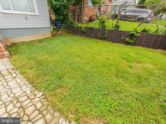 a view of backyard with a small cabin