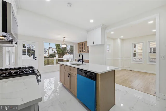 a kitchen with counter top space and sink