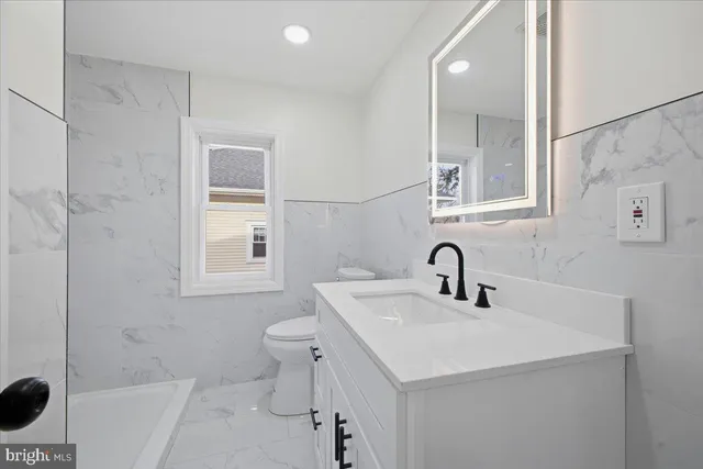 a bathroom with a sink and a toilet