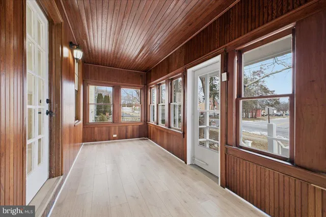 a view of an entryway with wooden floor