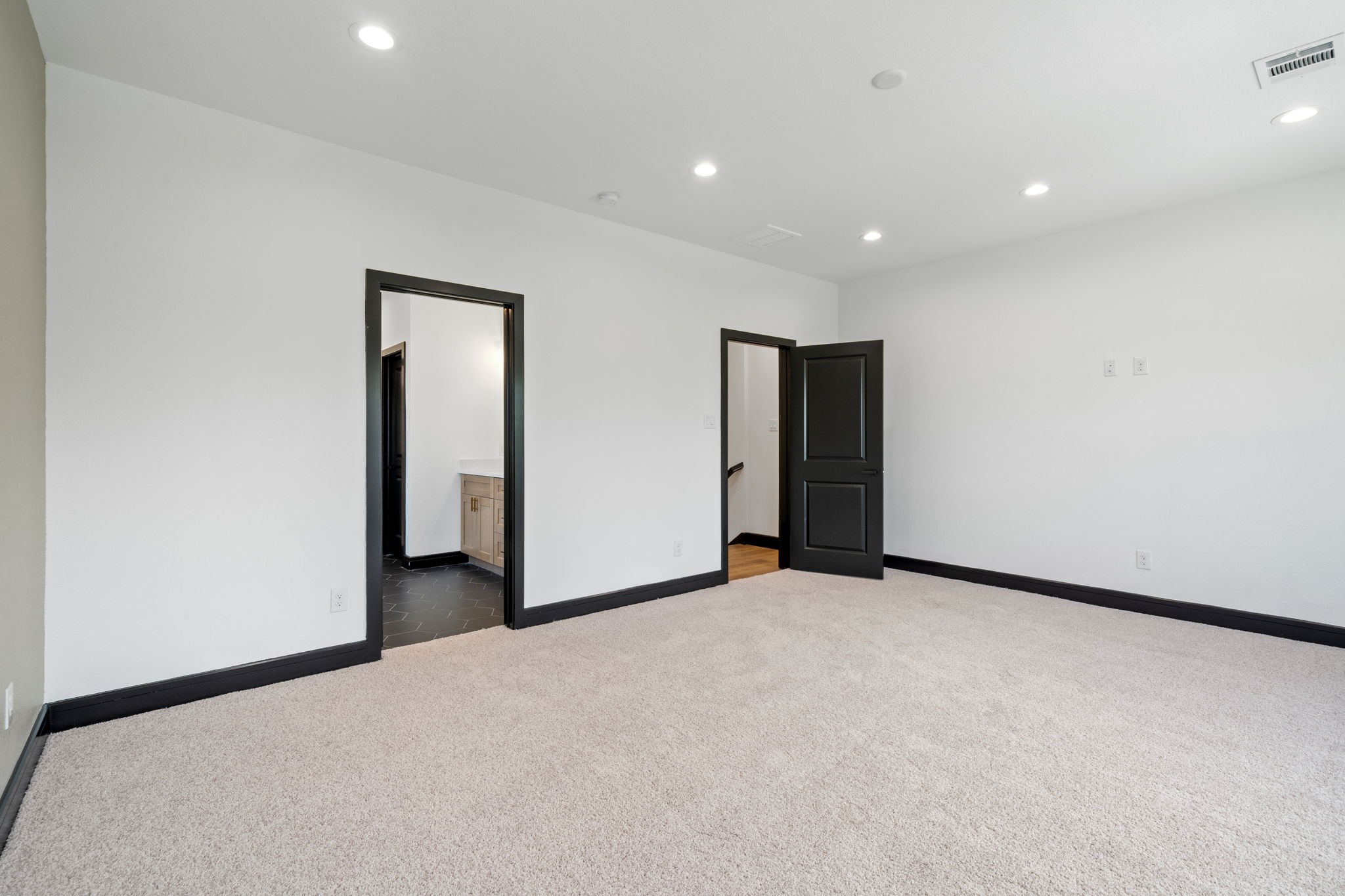 4437 Gunter Street, Unit AB Houston, TX 77020 - Photo 11 of 20 a view of an empty room with wooden floor
