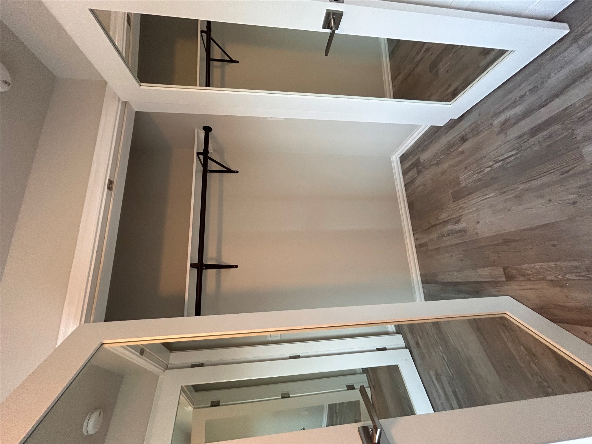 8920 Trone Circle, Unit B Austin, TX 78758 - Photo 14 of 19 a view of walk in closet with empty racks