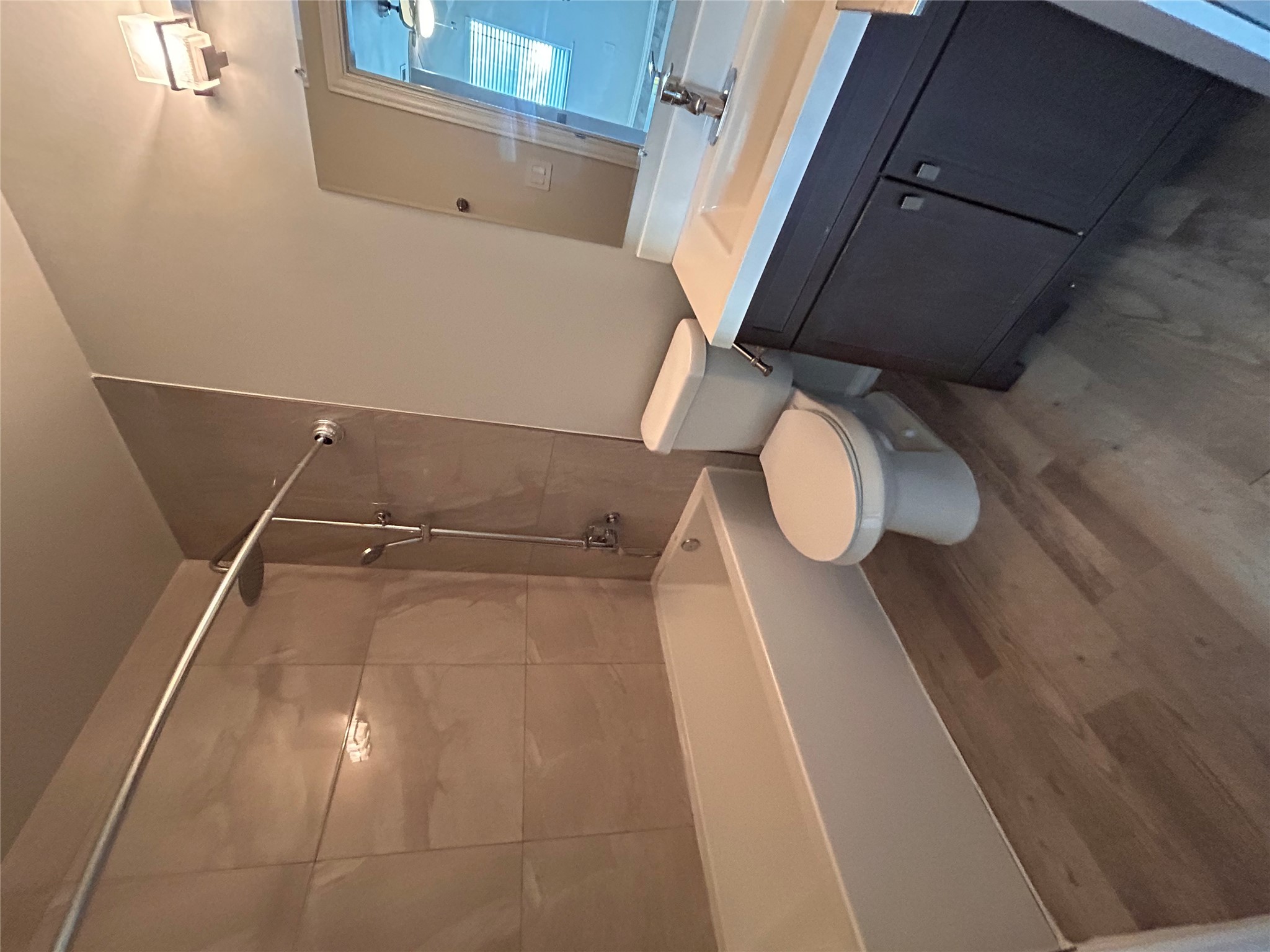 8920 Trone Circle, Unit B Austin, TX 78758 - Photo 18 of 19 a bathroom with a sink a toilet and a bathtub