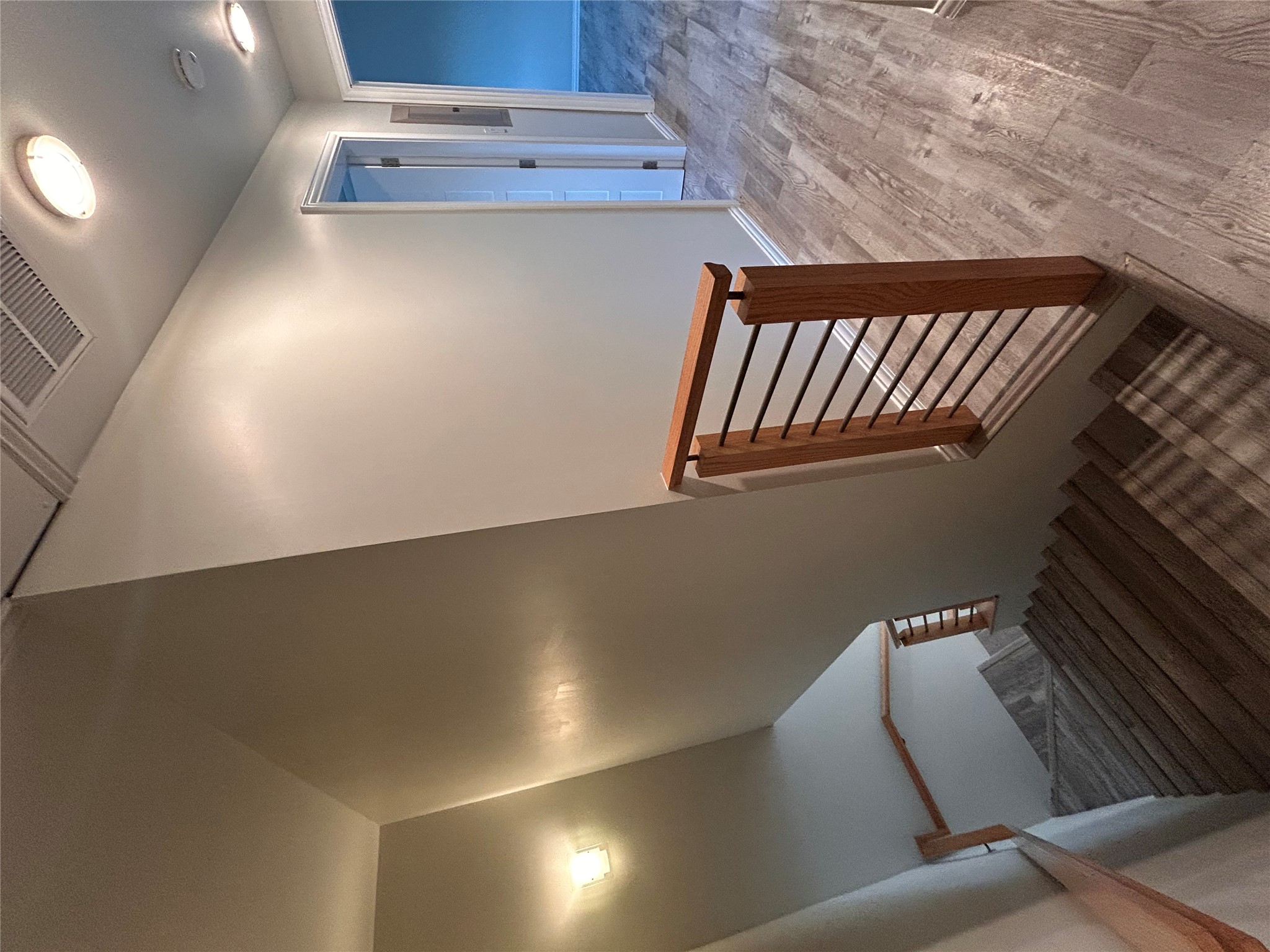 8920 Trone Circle, Unit B Austin, TX 78758 - Photo 19 of 19 a view of a hallway with wooden floor