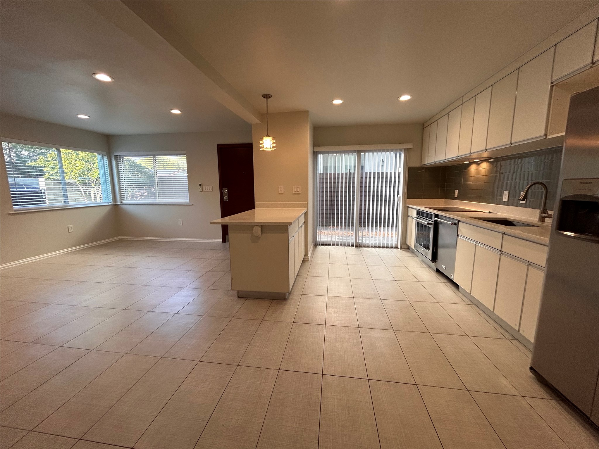 8920 Trone Circle, Unit B Austin, TX 78758 - Photo 4 of 19 a large kitchen with stainless steel appliances granite countertop a sink and cabinets