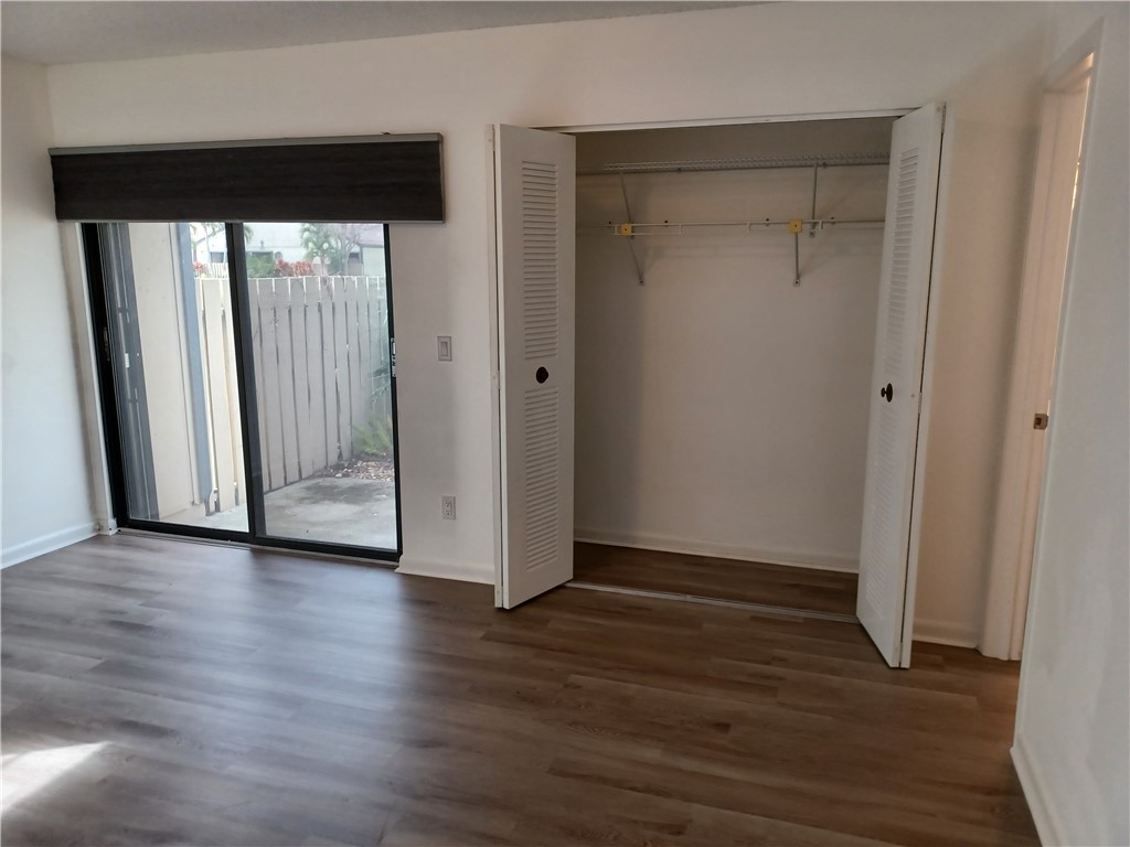 Undisclosed Address Vero Beach, FL 32960 - Photo 16 of 18 a view of a room with wooden floor and window