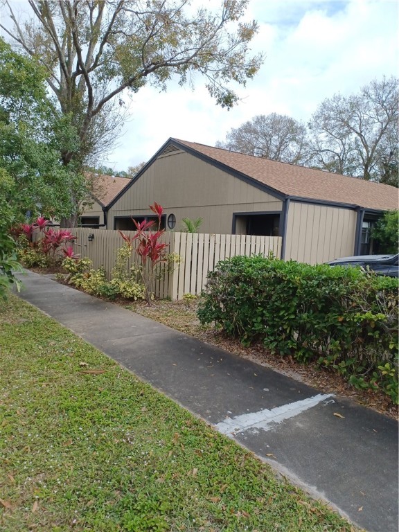 Undisclosed Address Vero Beach, FL 32960 - Photo 2 of 18 a front view of a house with a yard and garage