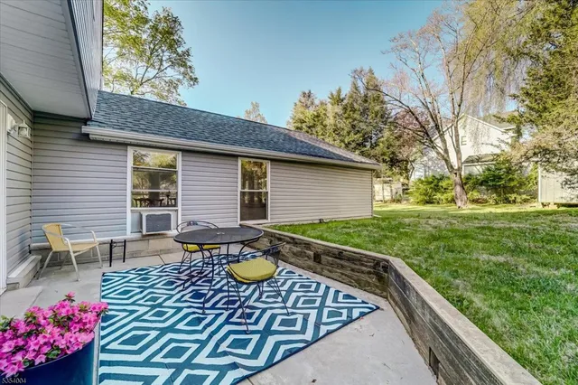 a front view of house with yard and seating