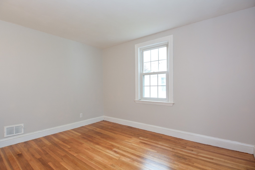 95 Sunset Avenue Dedham, MA 02026 - Photo 16 of 39 wooden floor in an empty room with a window