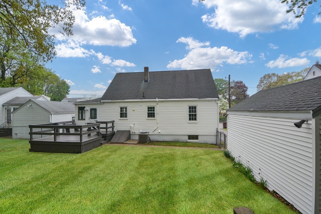 95 Sunset Avenue Dedham, MA 02026 - Photo 34 of 39 a view of a house with a backyard
