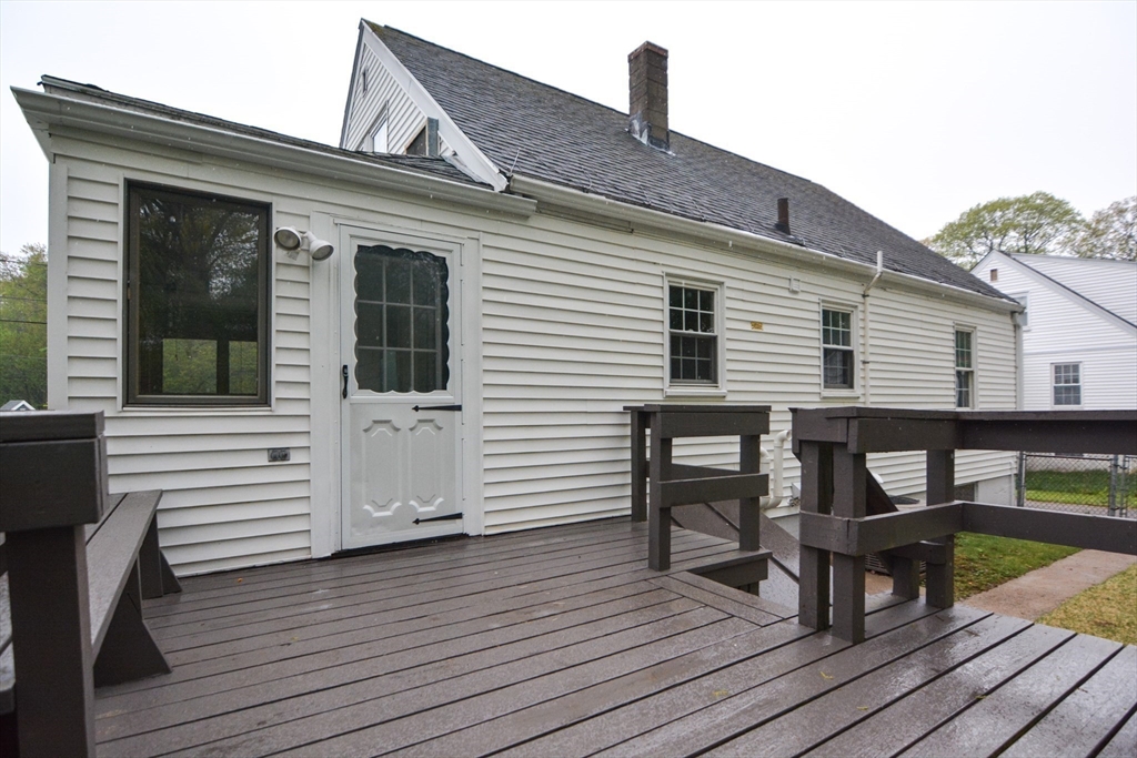 95 Sunset Avenue Dedham, MA 02026 - Photo 35 of 39 a view of a house with wooden deck