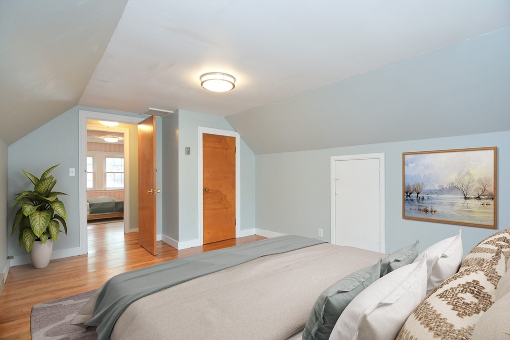 95 Sunset Avenue Dedham, MA 02026 - Photo 4 of 39 a bedroom with a large bed and a large window
