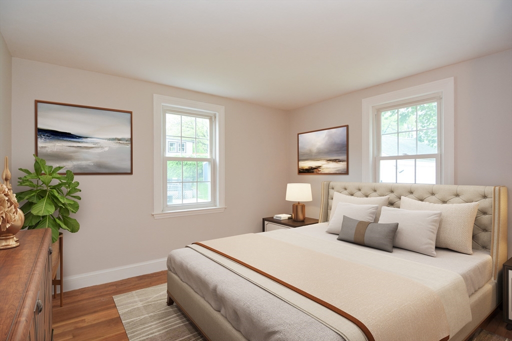 95 Sunset Avenue Dedham, MA 02026 - Photo 8 of 39 a bedroom with a bed and a potted plant