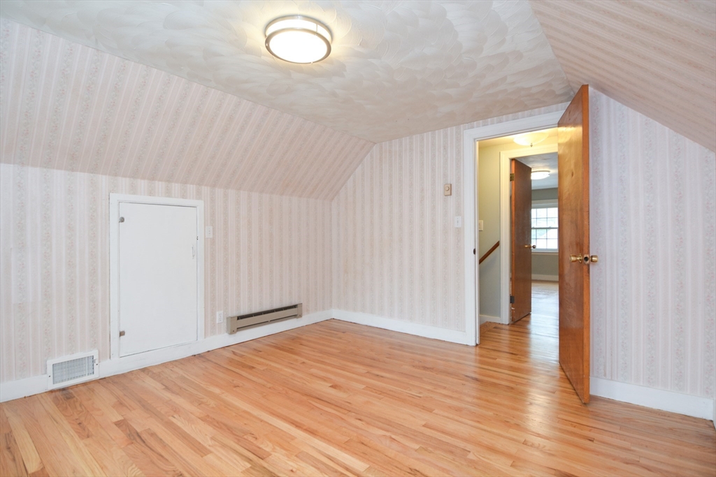 95 Sunset Avenue Dedham, MA 02026 - Photo 9 of 39 a view of empty room with wooden floor
