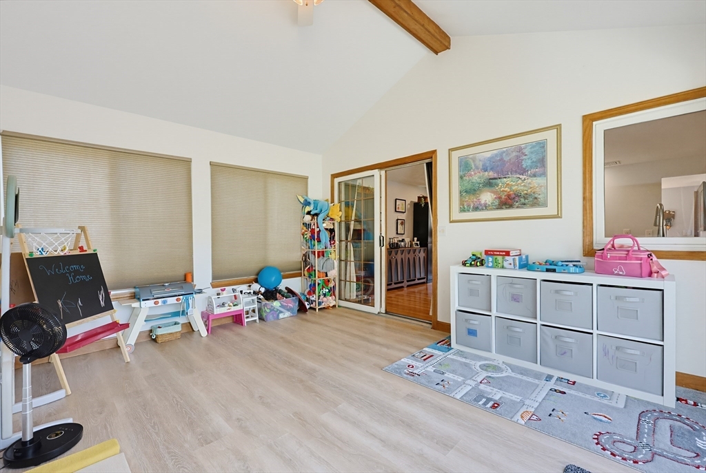 19 Weir Road Waltham, MA 02451 - Photo 21 of 41 a bedroom with furniture and a wooden floor