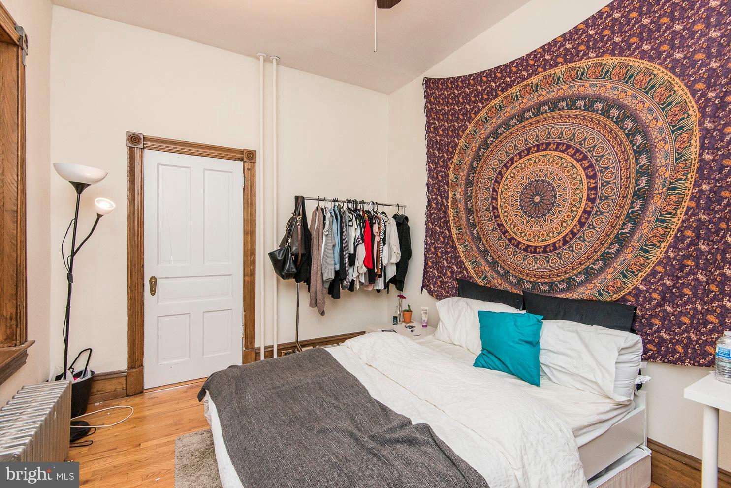 133 Dupont Street Philadelphia, PA 19127 - Photo 11 of 24 a bedroom with a bed and a mirror
