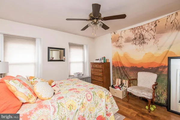 a bedroom with a bed furniture and a window