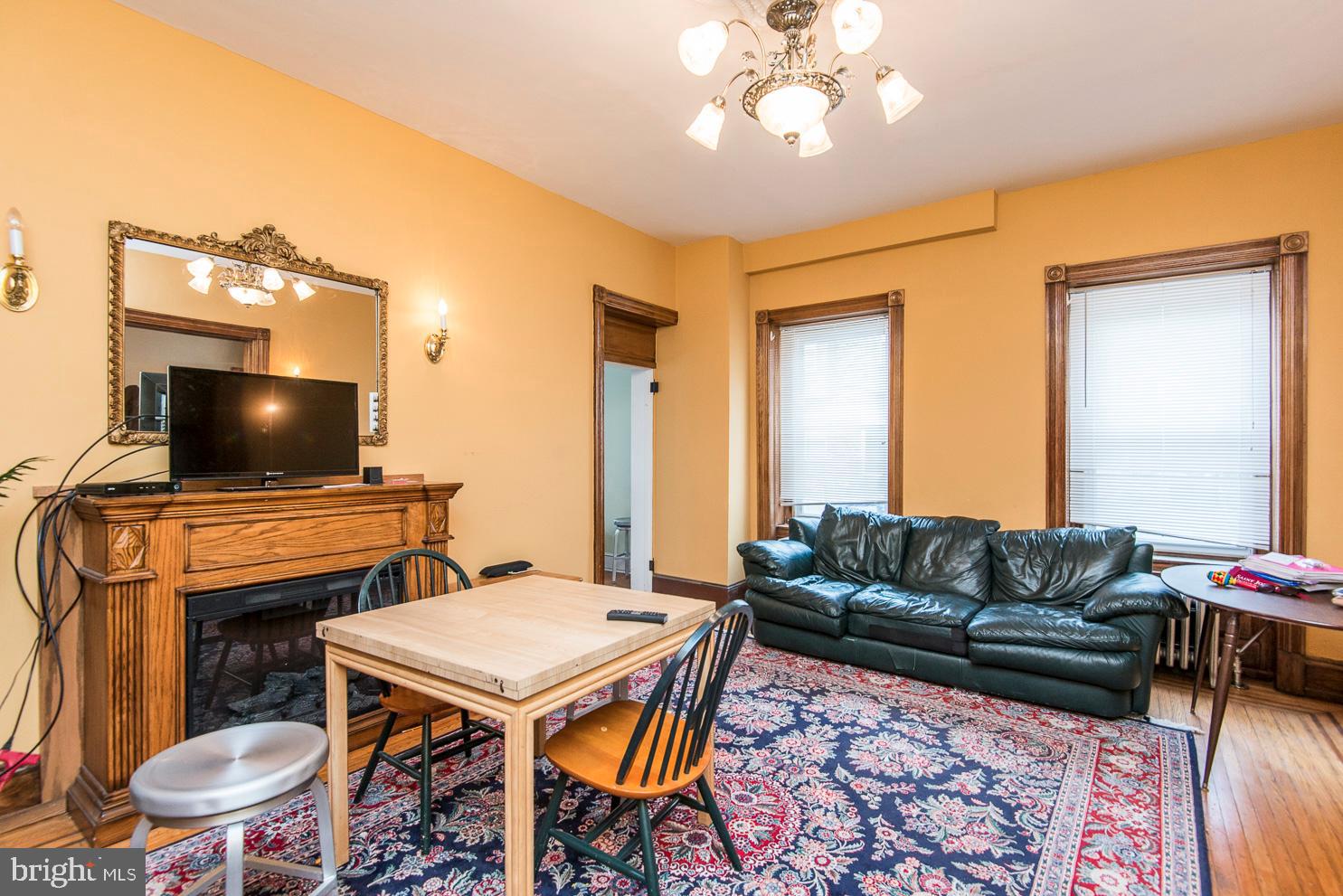 133 Dupont Street Philadelphia, PA 19127 - Photo 7 of 24 a living room with furniture and a flat screen tv