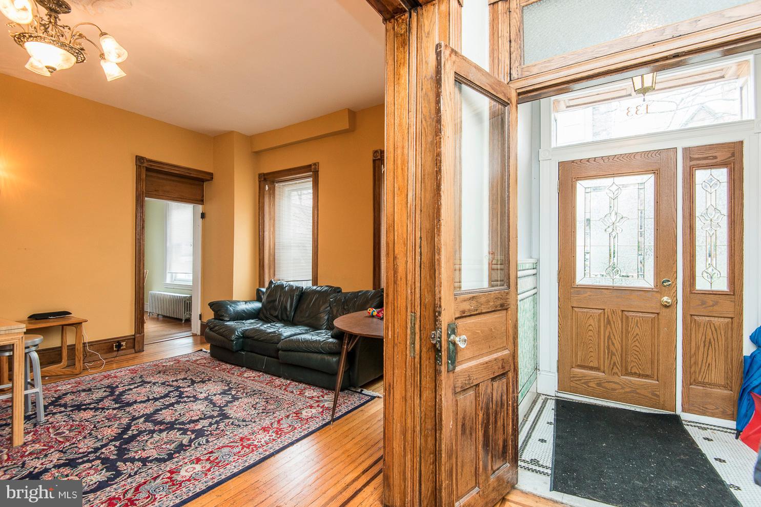 133 Dupont Street Philadelphia, PA 19127 - Photo 8 of 24 a living room with furniture and a rug