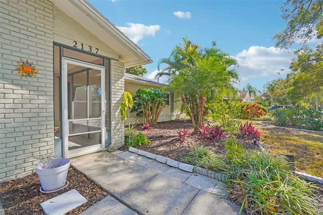 a view of a porch with potted plants
