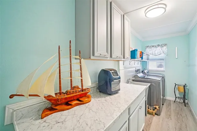 a kitchen with a refrigerator and a stove top oven