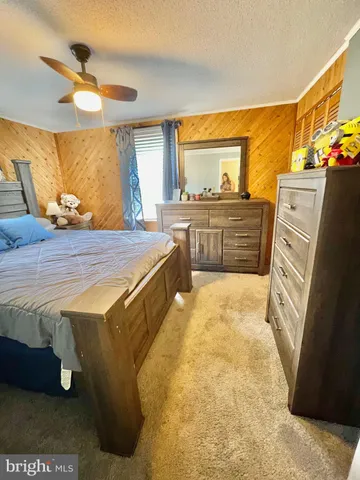 a bed room with a bed and a television