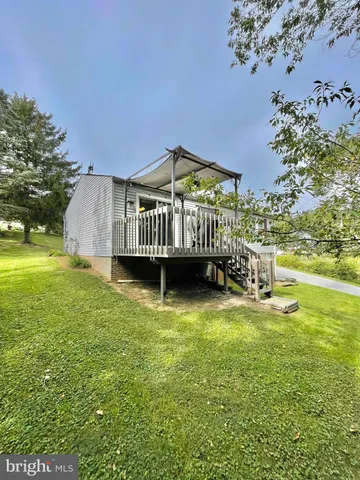 a big house with swimming pool in front of it