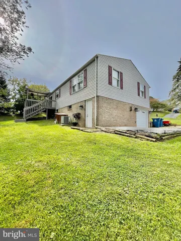 a view of a park with large trees