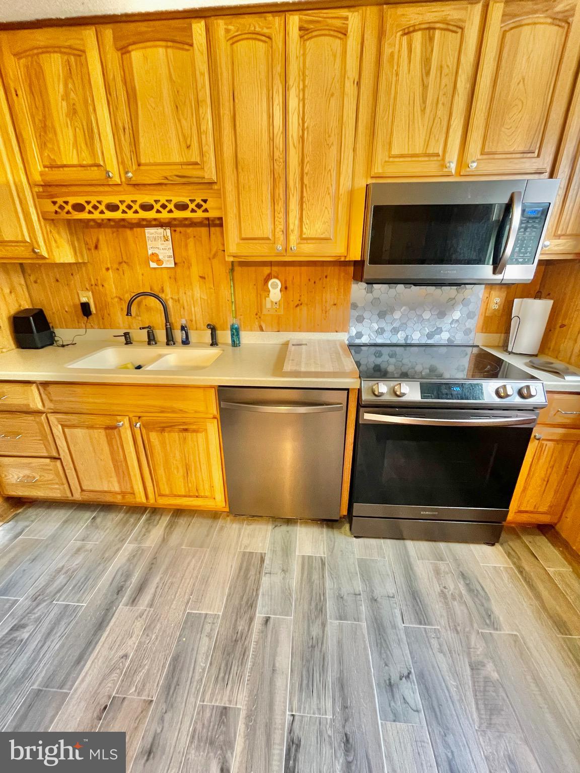 1 Valley View Road York, PA 17403 - Photo 10 of 40 a view of a kitchen with wooden floor and stainless steel appliances
