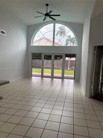 an empty room with glass door