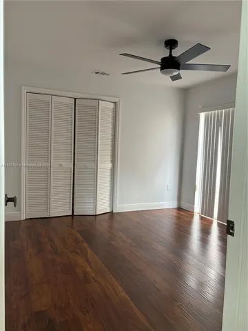 a view of a hallway with a white door