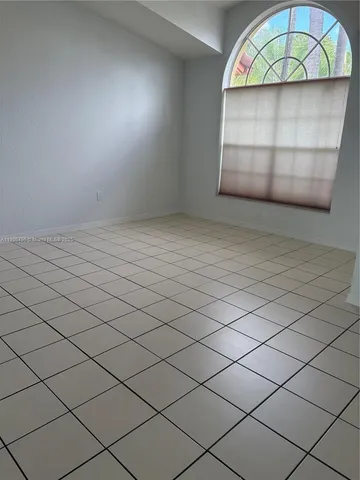 a kitchen with stainless steel appliances a sink a stove a microwave a counter top space and cabinets