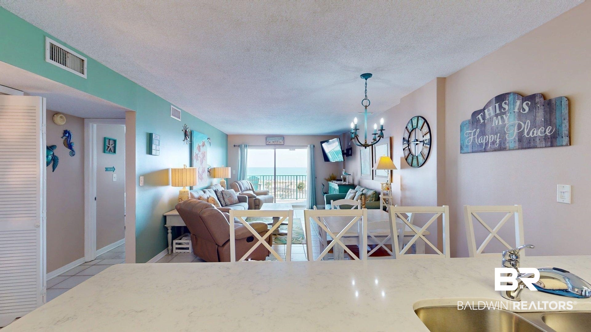 645 Plantation Road, Unit 6503 Gulf Shores, AL 36542 - Photo 24 of 53 Dining room featuring a textured ceiling, a chandelier, and light tile patterned floors