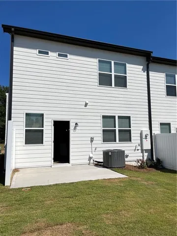 a view of a swimming pool with an outdoor space and seating area