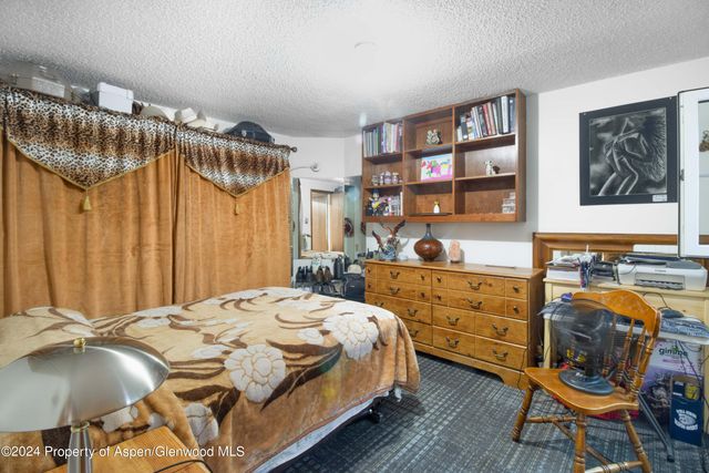 a bedroom with a bed and a cabinets